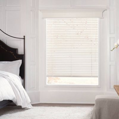 white blinds in a bedroom